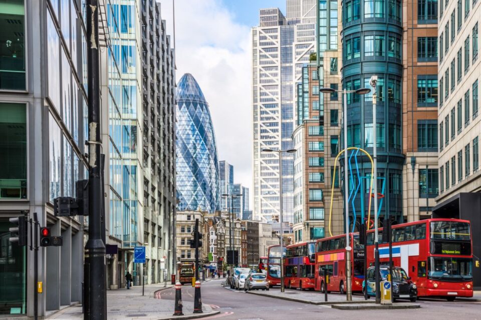 Downtown London office buildings, red bus