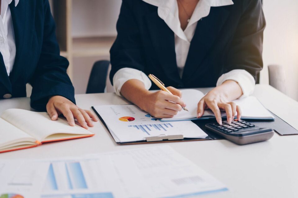 Business people meeting to analyze and discuss the situation on the financial report in meeting room. Meeting planning budget and cost. Business financial analysis and strategy concept. stock photo